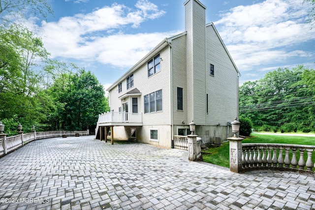 235 Leesville Rd, Jackson, NJ 08527 - rear view of house featuring a chimney