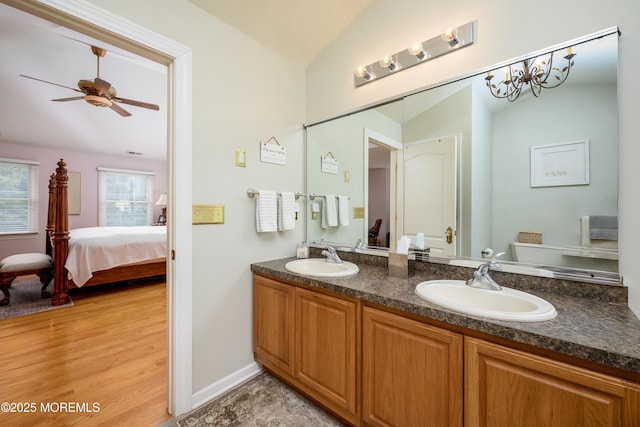 235 Leesville Rd, Jackson, NJ 08527 - full bathroom featuring lofted ceiling, double vanity, connected bathroom, wood finished floors, and ceiling fan