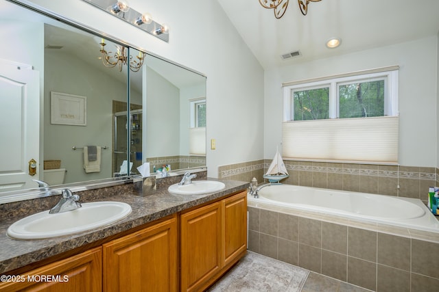 235 Leesville Rd, Jackson, NJ 08527 - bathroom featuring a bath, double vanity, tile patterned flooring, a stall shower, and a chandelier