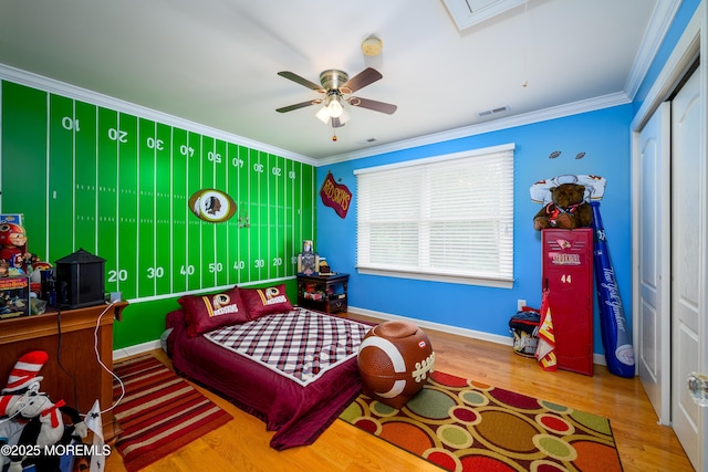 235 Leesville Rd, Jackson, NJ 08527 - bedroom featuring attic access, crown molding, wood finished floors, a closet, and a ceiling fan