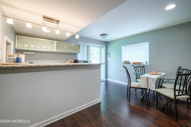 235 Leesville Rd, Jackson, NJ 08527 - kitchen featuring dark wood finished floors, glass insert cabinets, light stone countertops, track lighting, and white cabinets