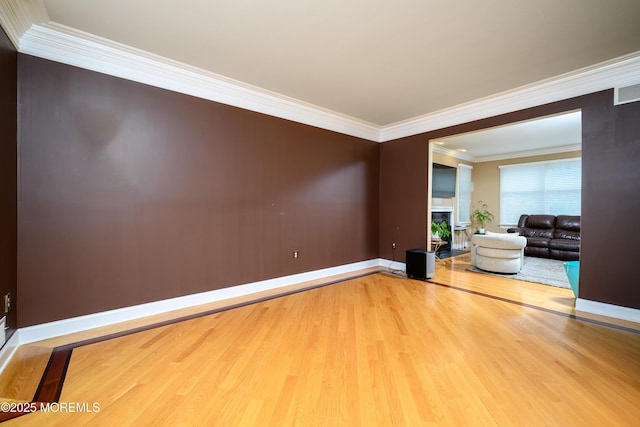 235 Leesville Rd, Jackson, NJ 08527 - empty room with wood finished floors, ornamental molding, and a fireplace