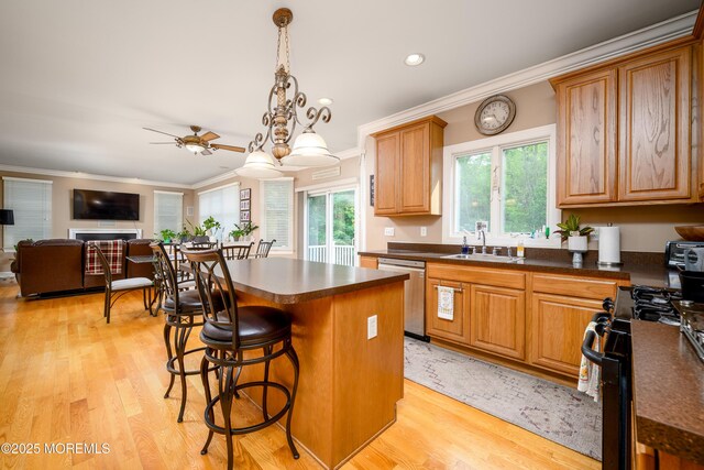 235 Leesville Rd, Jackson, NJ 08527 - kitchen featuring stainless steel dishwasher, range with gas stovetop, crown molding, dark countertops, and a ceiling fan