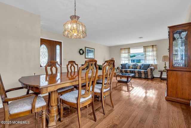 119 Barbados Dr S, Toms River, NJ 08757 - dining space with a chandelier and wood finished floors