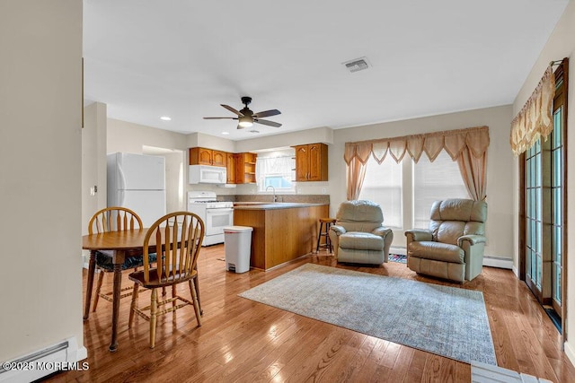 119 Barbados Dr S, Toms River, NJ 08757 - living room featuring ceiling fan, light wood-style flooring, baseboard heating, a baseboard radiator, and recessed lighting