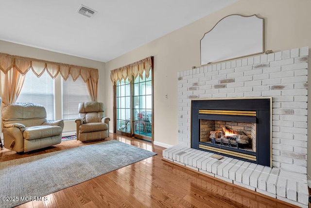119 Barbados Dr S, Toms River, NJ 08757 - living room featuring wood finished floors and a fireplace