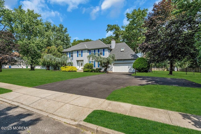 7 Crest Rd, Jackson, NJ 08527 - colonial house with driveway, a chimney, and a garage