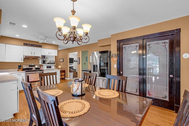 7 Crest Rd, Jackson, NJ 08527 - dining room with light wood-style floors, a chandelier, recessed lighting, and a ceiling fan