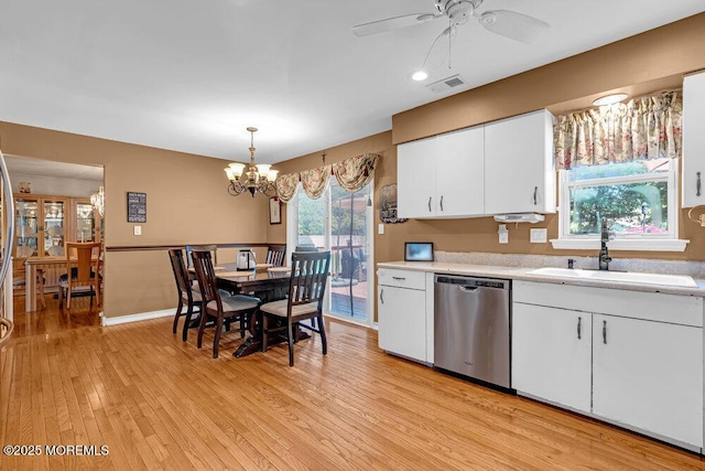 7 Crest Rd, Jackson, NJ 08527 - kitchen featuring stainless steel dishwasher, light countertops, light wood finished floors, ceiling fan, and a chandelier