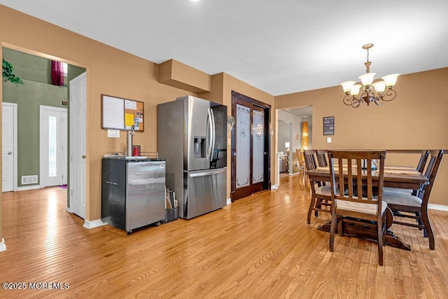 7 Crest Rd, Jackson, NJ 08527 - dining area with light wood-type flooring and a chandelier