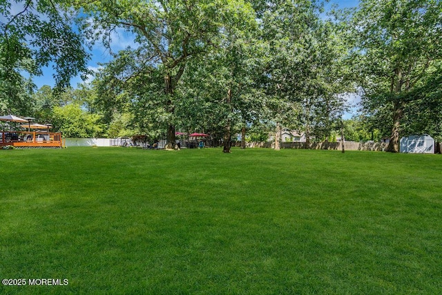 7 Crest Rd, Jackson, NJ 08527 - fenced backyard featuring a storage shed and a deck