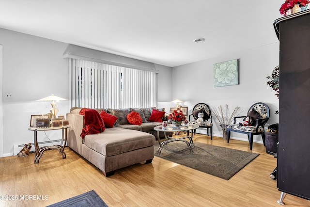 7 Beaverbrook Dr, Toms River, NJ 08757 - living room with baseboard heating and wood finished floors