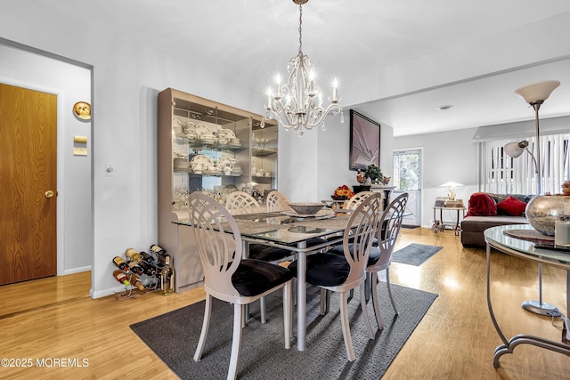 7 Beaverbrook Dr, Toms River, NJ 08757 - dining area featuring a chandelier and light wood-style flooring