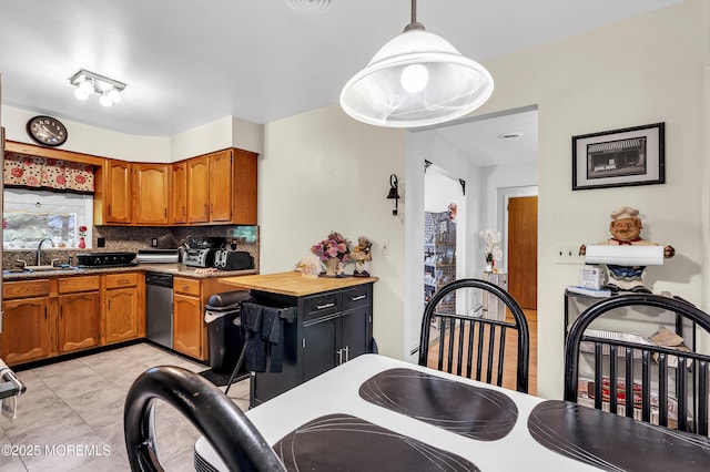 7 Beaverbrook Dr, Toms River, NJ 08757 - kitchen featuring dishwasher, brown cabinetry, backsplash, and hanging light fixtures