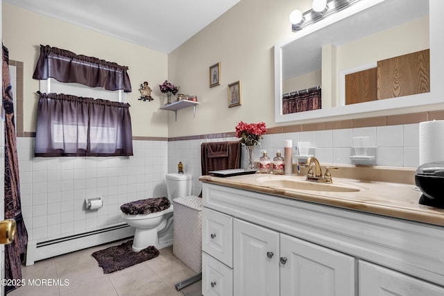 7 Beaverbrook Dr, Toms River, NJ 08757 - bathroom with a baseboard heating unit, tile patterned floors, vanity, tile walls, and a wainscoted wall