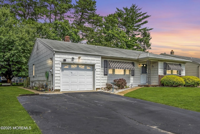 7 Beaverbrook Dr, Toms River, NJ 08757 - view of front of property with a chimney, a garage, driveway, and a front yard