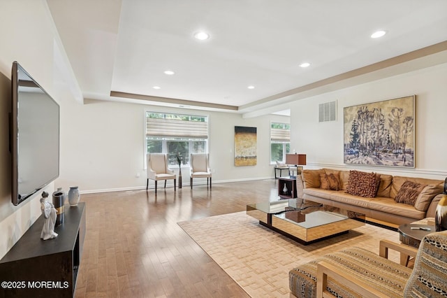 6 Day Star Rd, Manalapan, NJ 07726 - living area with a raised ceiling, recessed lighting, and wood finished floors