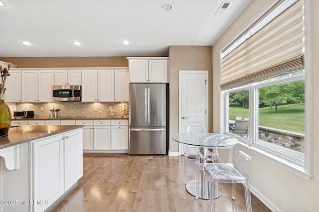 6 Day Star Rd, Manalapan, NJ 07726 - kitchen featuring appliances with stainless steel finishes, tasteful backsplash, light wood-style floors, white cabinetry, and recessed lighting