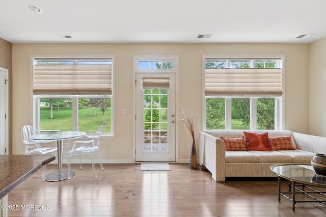 6 Day Star Rd, Manalapan, NJ 07726 - living room featuring wood finished floors and healthy amount of natural light