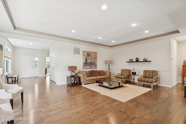 6 Day Star Rd, Manalapan, NJ 07726 - living room with a raised ceiling, recessed lighting, and wood finished floors