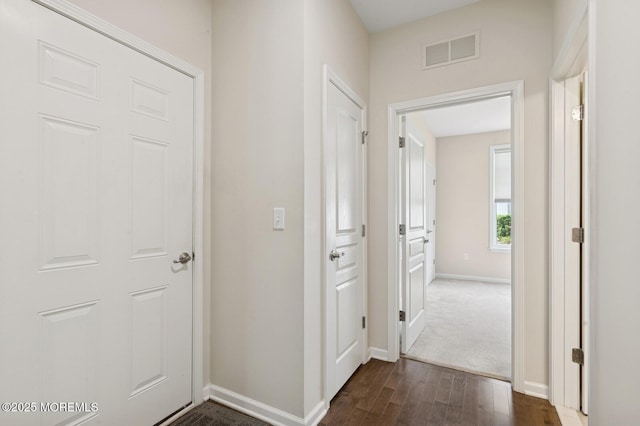 6 Day Star Rd, Manalapan, NJ 07726 - corridor with dark wood-type flooring and baseboards