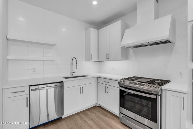 218 3rd Ave Unit 204, Asbury Park, NJ 07712 - kitchen featuring stainless steel appliances, custom range hood, decorative backsplash, white cabinets, and recessed lighting