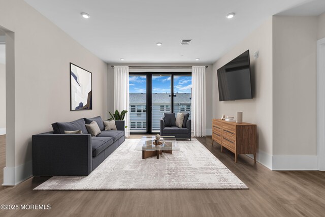 218 3rd Ave Unit 204, Asbury Park, NJ 07712 - living area featuring wood finished floors and recessed lighting