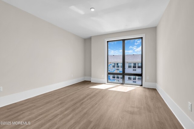 218 3rd Ave Unit 204, Asbury Park, NJ 07712 - spare room featuring wood finished floors and baseboards