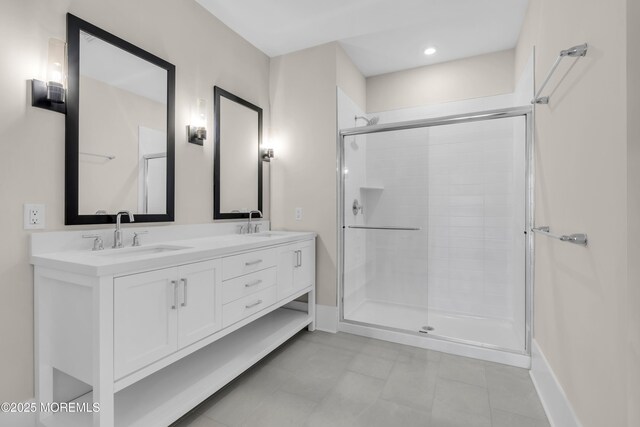 218 3rd Ave Unit 204, Asbury Park, NJ 07712 - bathroom featuring a stall shower, double vanity, tile patterned floors, and recessed lighting