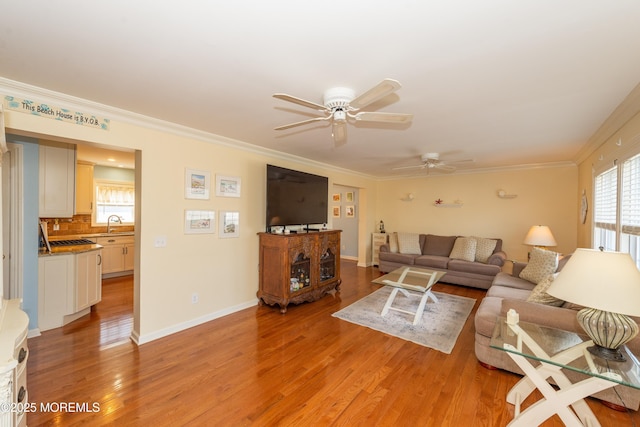 45 Fielder Ave, Seaside Heights, NJ 08751 - living area featuring light wood finished floors, a ceiling fan, and ornamental molding