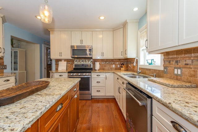 45 Fielder Ave, Seaside Heights, NJ 08751 - kitchen with stainless steel appliances, light wood-style floors, light stone countertops, recessed lighting, and decorative backsplash