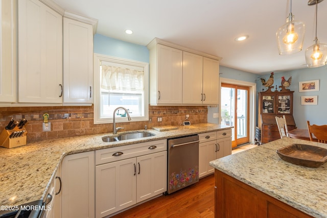 45 Fielder Ave, Seaside Heights, NJ 08751 - kitchen featuring stainless steel dishwasher, tasteful backsplash, plenty of natural light, wood finished floors, and recessed lighting