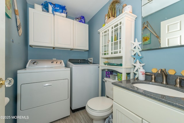 45 Fielder Ave, Seaside Heights, NJ 08751 - bathroom featuring washer and clothes dryer, vanity, and wood finished floors