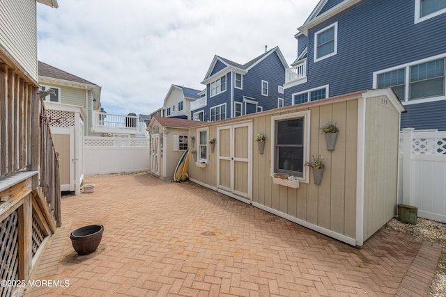 45 Fielder Ave, Seaside Heights, NJ 08751 - fenced backyard featuring a storage shed and a patio