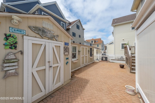 45 Fielder Ave, Seaside Heights, NJ 08751 - view of patio featuring a storage shed and a residential view
