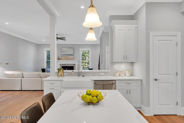 451 Woodbury Dr, Jackson, NJ 08527 - kitchen featuring dishwasher, crown molding, open floor plan, white cabinetry, and light wood-style flooring