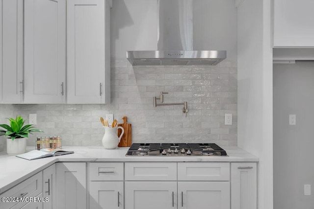 451 Woodbury Dr, Jackson, NJ 08527 - kitchen featuring wall chimney exhaust hood, stainless steel gas stovetop, white cabinets, and decorative backsplash