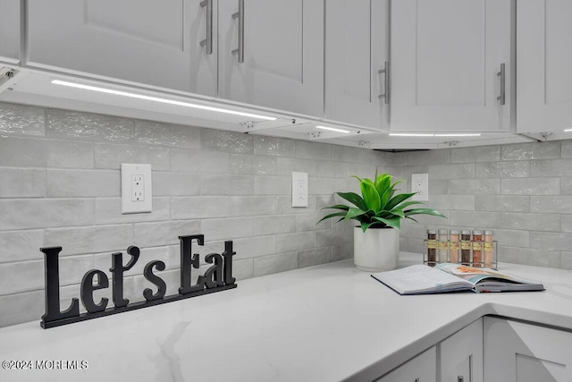 451 Woodbury Dr, Jackson, NJ 08527 - kitchen view of light countertops, tasteful backsplash, and white cabinets