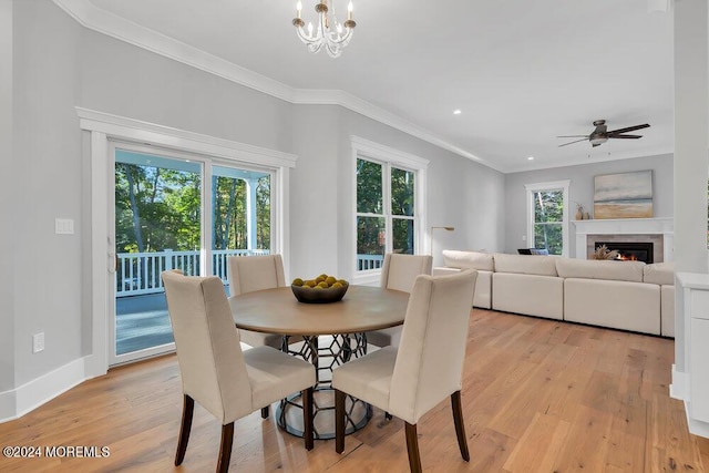 451 Woodbury Dr, Jackson, NJ 08527 - dining room featuring crown molding, light wood-type flooring, a glass covered fireplace, a ceiling fan, and recessed lighting