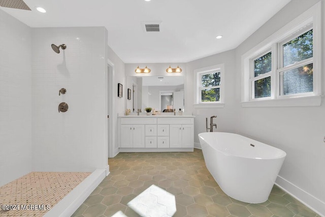 451 Woodbury Dr, Jackson, NJ 08527 - full bathroom featuring a tile shower, double vanity, a freestanding tub, recessed lighting, and tile patterned flooring