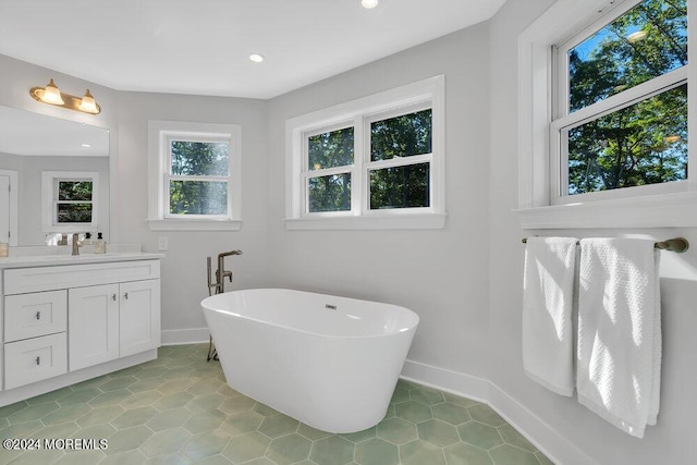 451 Woodbury Dr, Jackson, NJ 08527 - bathroom featuring vanity, a freestanding bath, tile patterned floors, and recessed lighting