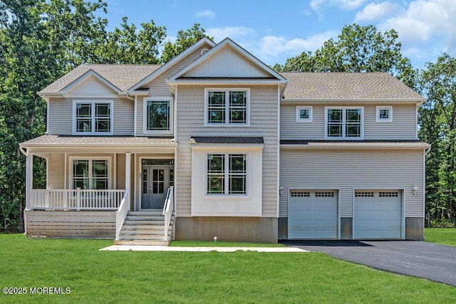 451 Woodbury Dr, Jackson, NJ 08527 - view of front of house with driveway, a garage, a porch, and a front lawn