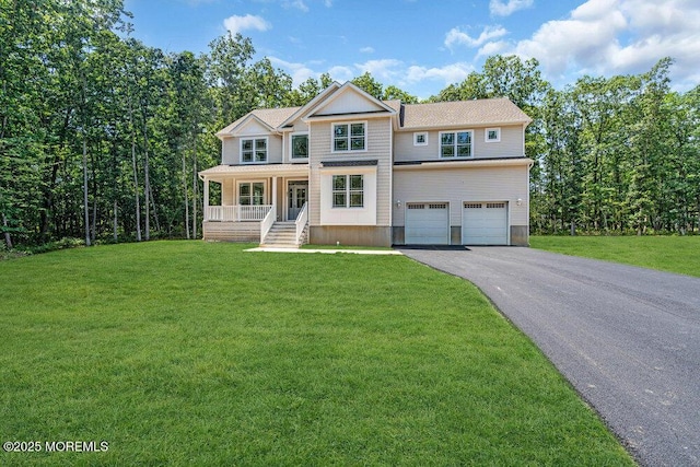 451 Woodbury Dr, Jackson, NJ 08527 - view of front of house with asphalt driveway, covered porch, an attached garage, and a front lawn