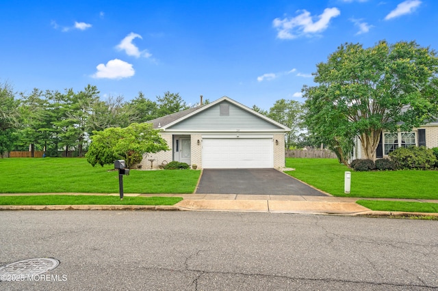 59 Mansfield Dr, Brick, NJ 08724 - ranch-style home featuring asphalt driveway, a front lawn, brick siding, and an attached garage