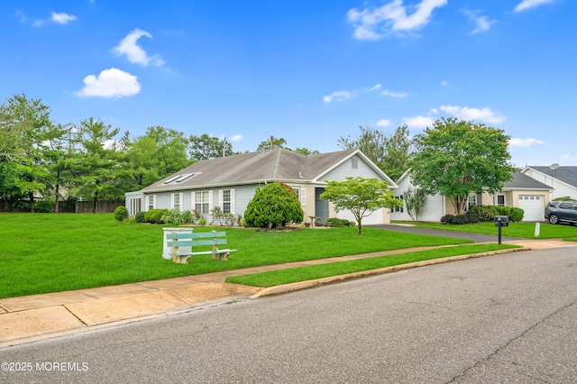 59 Mansfield Dr, Brick, NJ 08724 - view of front of property featuring asphalt driveway, a front yard, and an attached garage