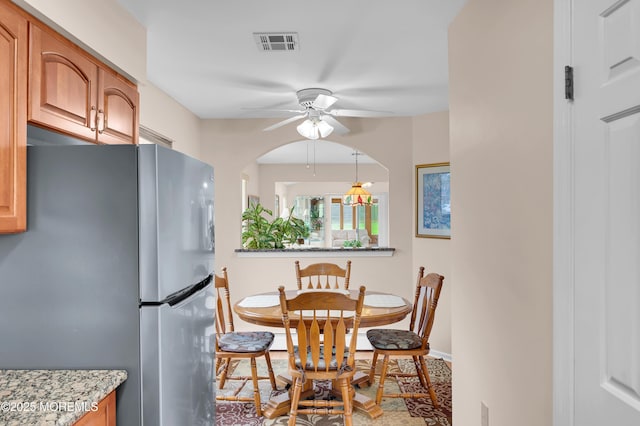 59 Mansfield Dr, Brick, NJ 08724 - dining area with ceiling fan, arched walkways, and baseboard heating