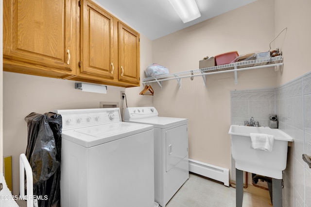 59 Mansfield Dr, Brick, NJ 08724 - washroom featuring a baseboard heating unit, cabinet space, and separate washer and dryer