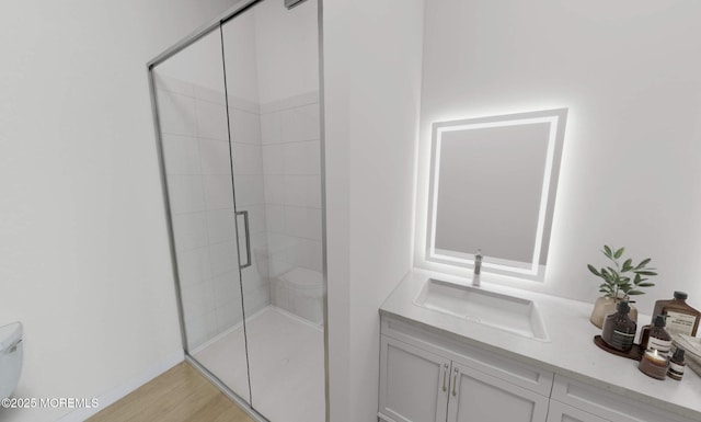 3 5th Ave Unit 102, Neptune City, NJ 07753 - bathroom featuring a shower stall, vanity, and wood finished floors