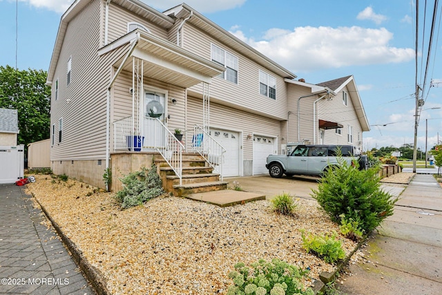 414 Bay Blvd Unit B, Seaside Heights, NJ 08751 - townhome / multi-family property with an attached garage and concrete driveway