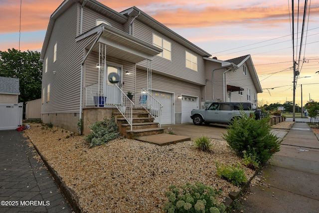 414 Bay Blvd Unit B, Seaside Heights, NJ 08751 - view of front of property with a garage and driveway